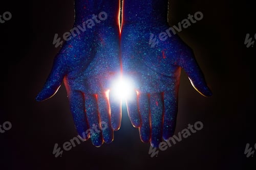 Preview: Light through the palms of your hands in ultraviolet, God and religion. Divine light through hand