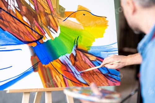 Preview: Part of abstract painting on sheet of paper and hand of artist with paintbrush