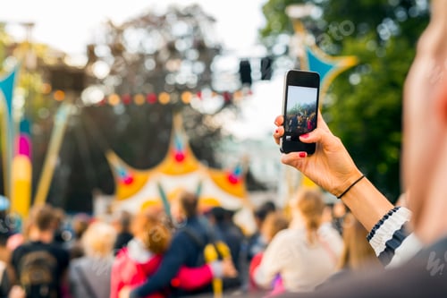 Preview: Woman photographing festival with smart phone
