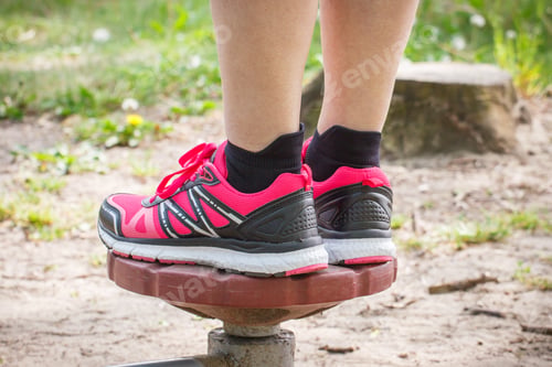 Preview: Legs of elderly senior woman on outdoor gym, healthy lifestyle concept