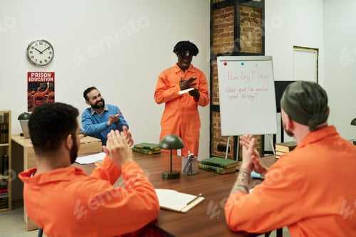Preview: Young Black Man Reciting Poetry to Multiethnic Inmates during Group Activity