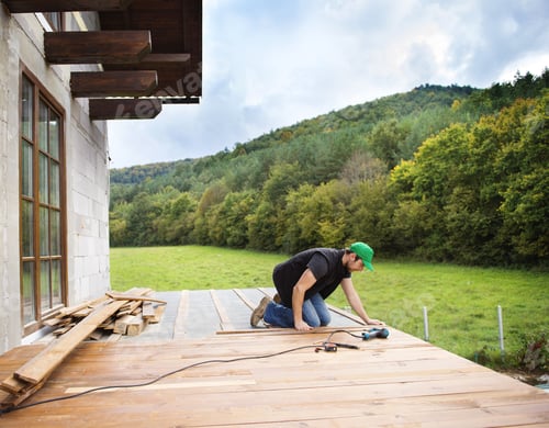 Preview: Handyman installing wooden flooring