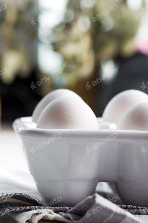 Preview: Ceramic container with natural organic farm eggs on a blurred kitchen background