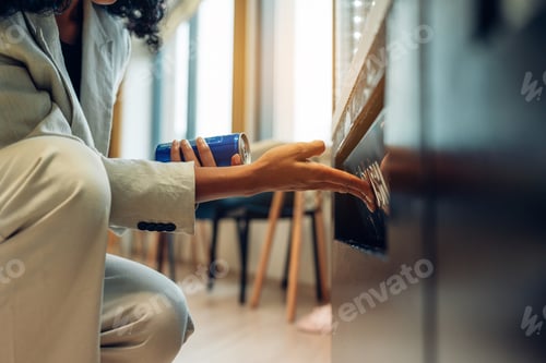 Preview: woman's finger pushing number button on keyboard of snack vending machine.