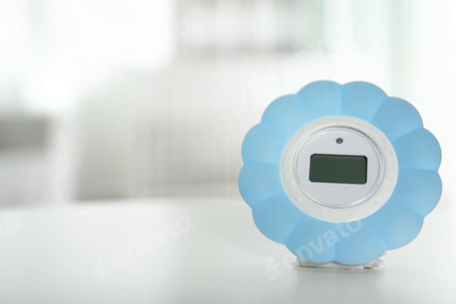 Preview: Digital temperature and humidity control in baby room interior. Space for text