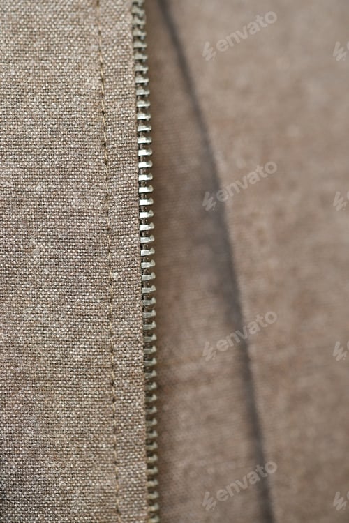 Preview: Macro of zipper of a brown jacket