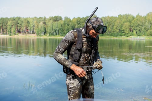 Preview: A spearfishing athlete is going to a fishing competition on a sunny summer day on the lake. He puts