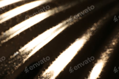 Preview: Blurred view of corrugated golden texture as background