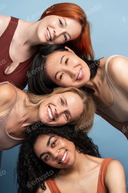 Preview: Portrait of smiling diverse women smiling and supporting each other, posing, looking at camera