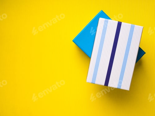 Preview: Gift boxes stack on yellow background