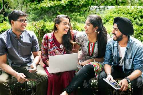 Preview: Group of Indian people are using computer laptop