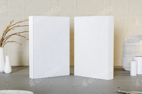 Two Books with White Covers and Yellow Branches
