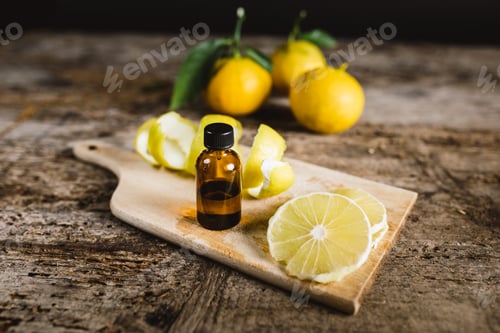 Preview: Lemon Slices and Citrus Oil on Wooden Table