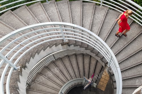 Preview: Woman in a red dress going down the spiral staircase