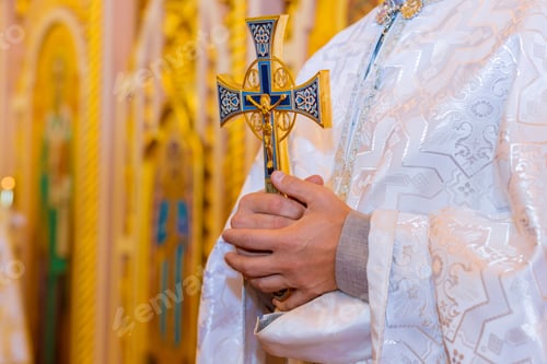 Preview: The holy orthodox father priest holds with a cross in his hands