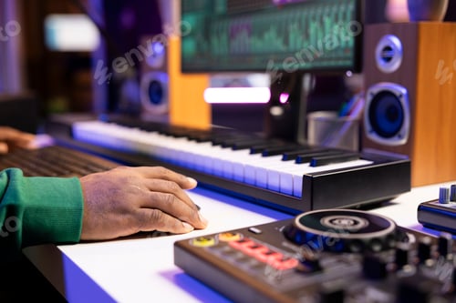 Preview: Sound designer operates on mixing console and digital software