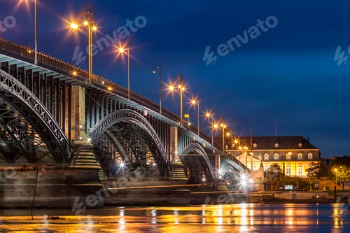 Preview: Beautiful sunset night over Rhine / Rhein river and old bridge in Mainz near Frankfurt