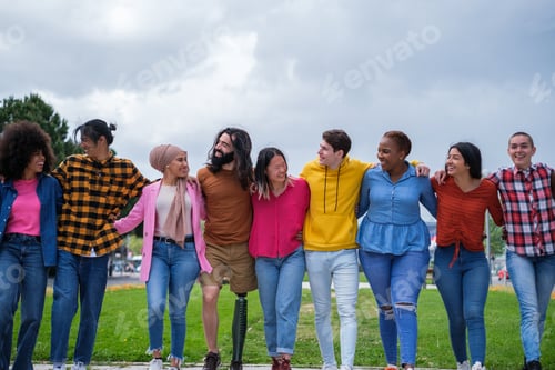 Preview: Group of ethnically diverse young people joining hands