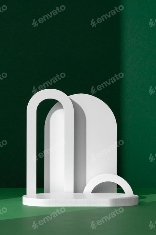 Preview: Modern White Architectural Shapes Against A Deep Green Background Displayed On A Simple Table