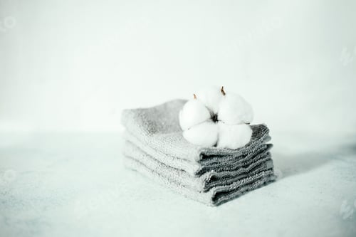 Preview: Stack of gray towels on the table