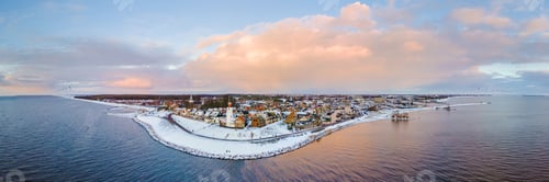 Preview: Lighthouse of Urk during winter with snow in the Netherlands. Dutch old village