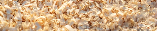 Preview: Sawdust or wood dust texture background. Close-up of sawdust. View from above. Banner for site.