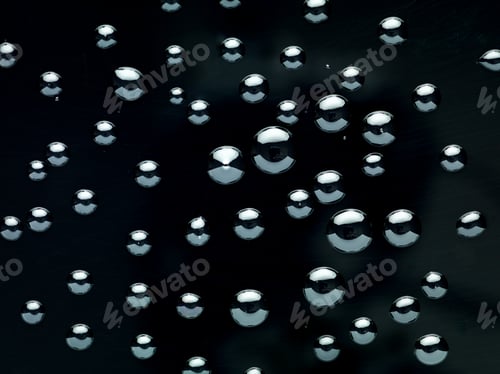 Preview: water drops on black background