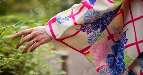 Preview: Woman, hands and leaves with kimono, park and travel for journey and natural sustainability. Japane