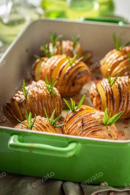 Preview: Delicious baked potatoes with fresh herbs and salt. Scandinavian cuisine.