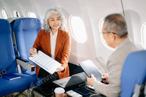 Preview: Business meeting in airplane, asian Mature businessman in private jet is talking