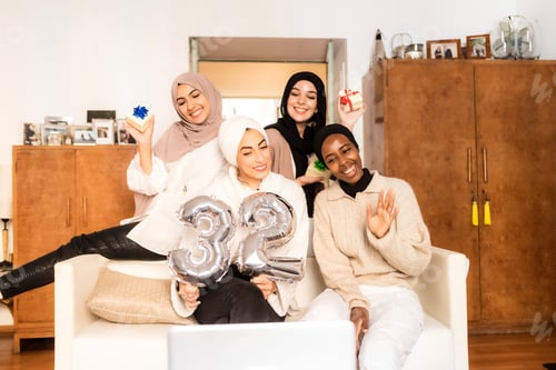 Preview: Friends celebrating together with joy and balloons.