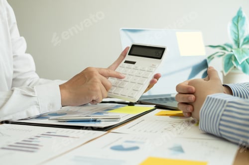 Preview: Two business leaders talk about charts, financial graphs showing results are analyzing