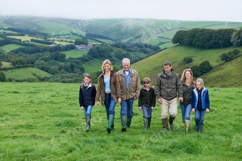 Preview: Generational family walking in fields