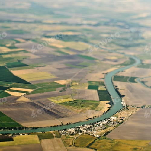 Preview: Aerial View of a River Passing Through Farmland