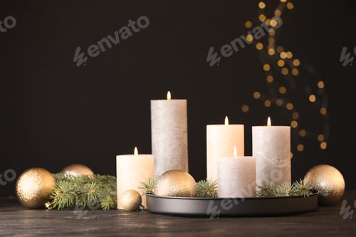 Preview: Burning candles with Christmas decoration on table. Space for text