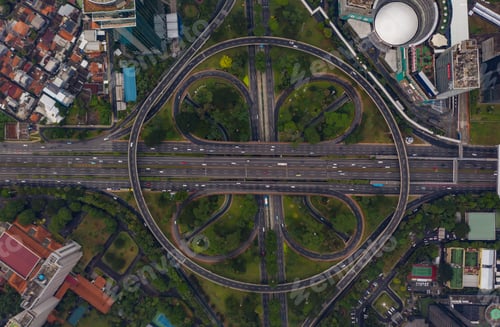 Preview: Top down overhead aerial view of large multi lane roundabout in Jakarta, Indonesia