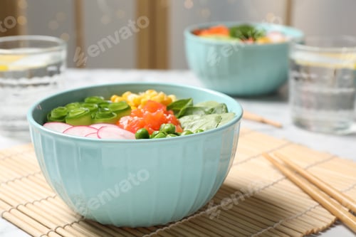 Preview: Delicious salad with salmon and vegetables served on table