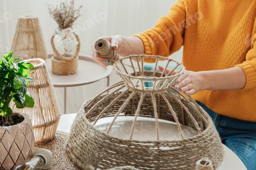 Preview: Woman makes handmade diy lamp from jute rope
