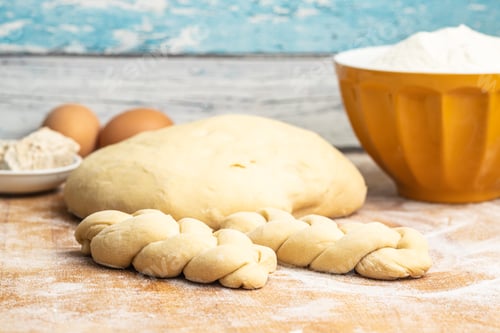 Preview: Unbaked braided bun dough. Raw dough.