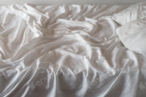 Preview: Top view of wrinkles on an unmade bed sheet
