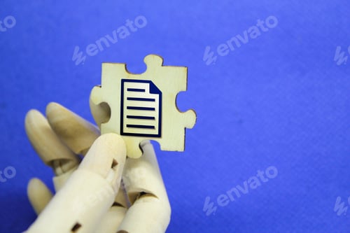Preview: hand holding wooden puzzle with file icon