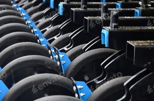Preview: Row of wheels of the new industrial agricultural seeder close up