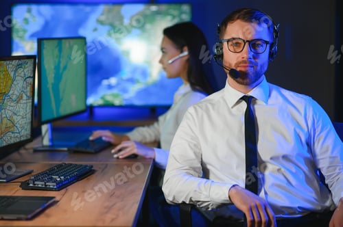 Preview: Photo of a successful dispatcher working on a computer in the office