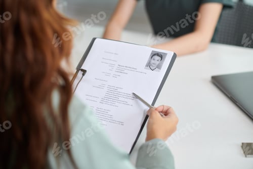 Preview: HR Manager Reading CV of Applicant