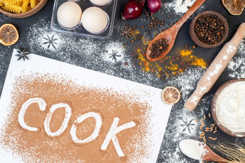 Preview: top view cook writing with eggs vegetables raw pasta and seasonings on a dark background dough