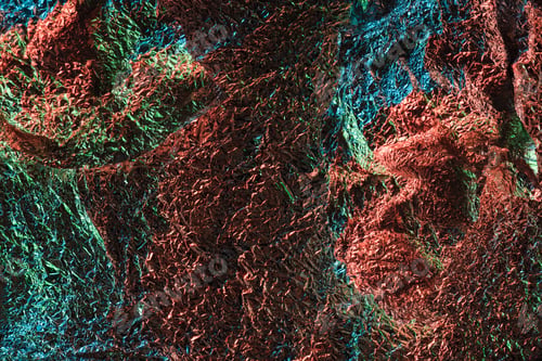 Preview: abstract background of glossy textured crumpled foil with colorful illumination