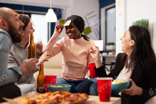 Preview: African american woman playing guess who game with coworkers