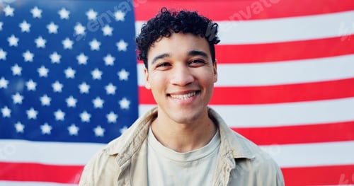 Preview: Man, portrait and american flag for billboard fabric, smile and heritage in background. Male model,