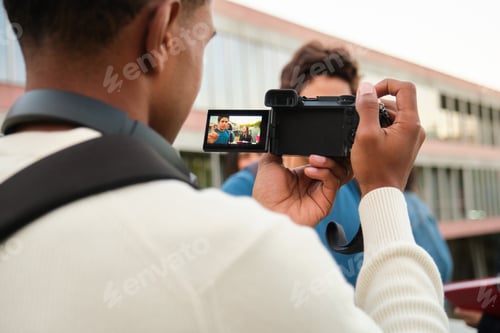 Preview: Man recording video with camera for online content