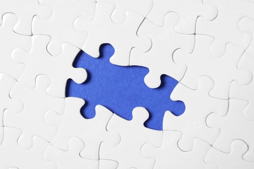 Preview: Blank white puzzle with missing pieces on blue background, top view